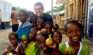 Taylor Winn with children in Ghana